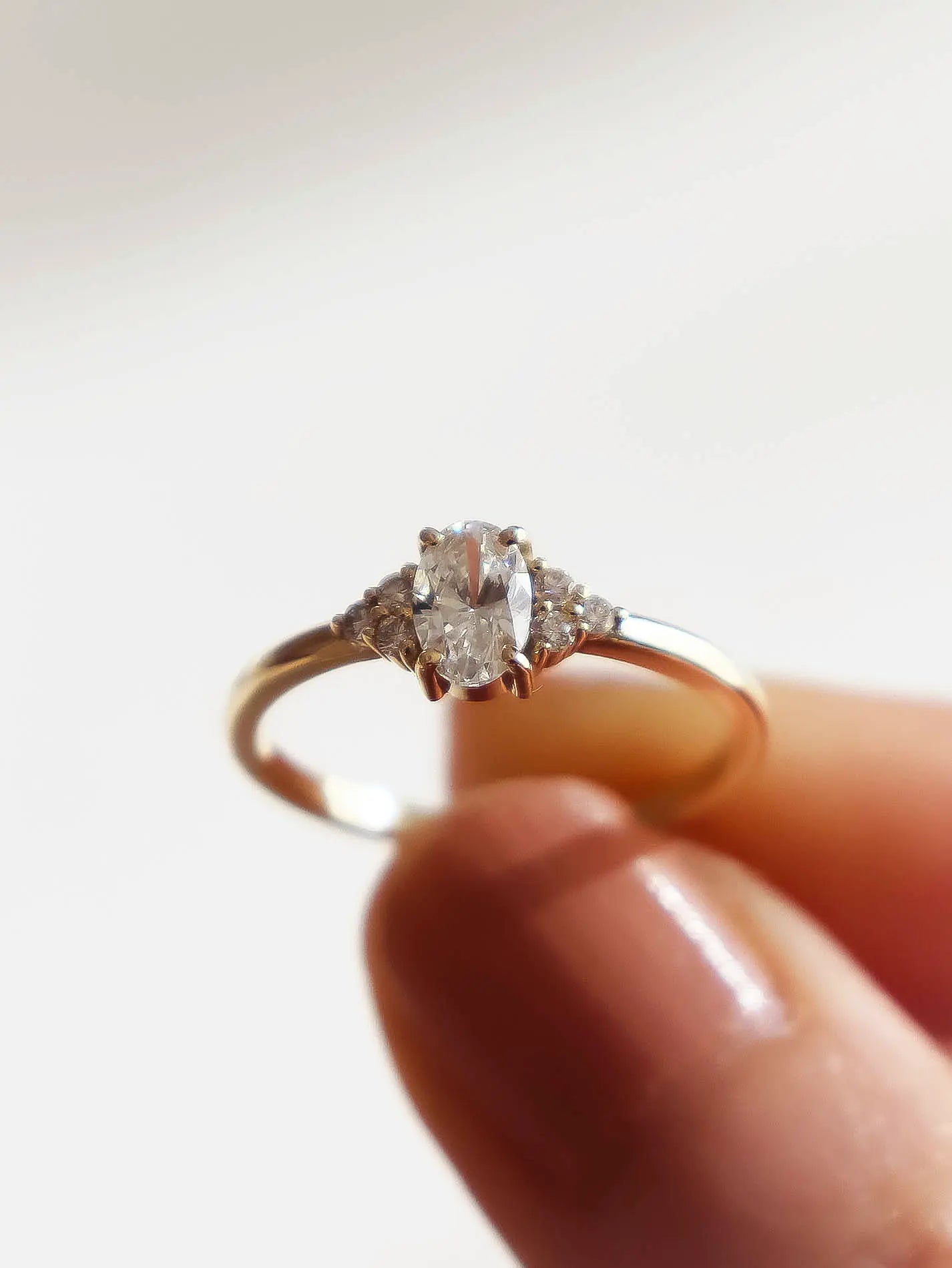 Camille. Oval diamond ring with diamond accents