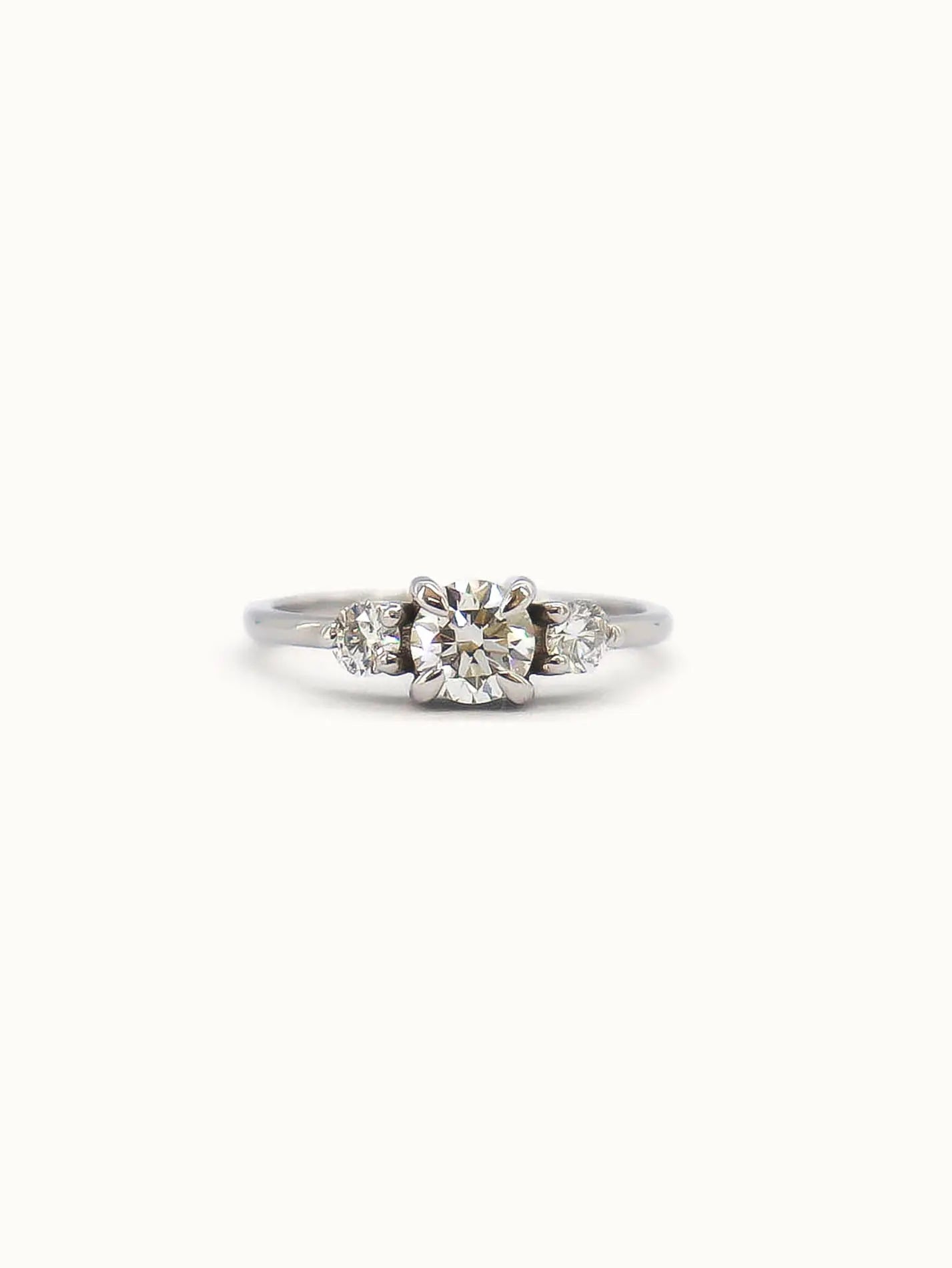 Aurora. Round Diamond Three Stone Engagement Ring