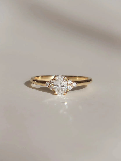 Camille. Oval diamond ring with diamond accents