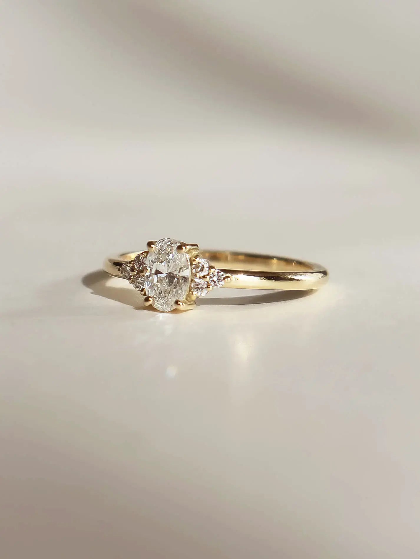 Camille. Oval diamond ring with diamond accents